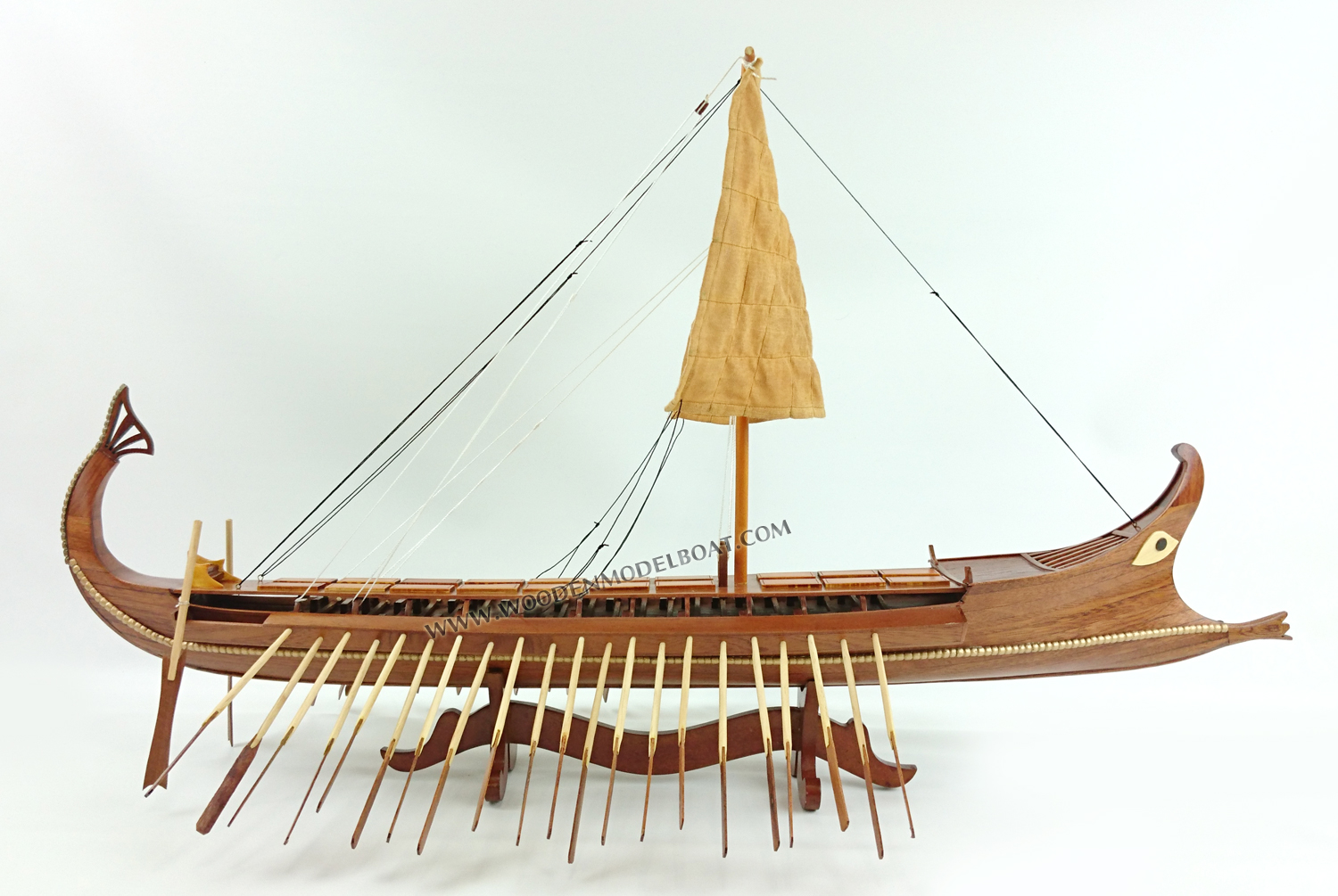 Bireme, ship with two series of oars in each side, was the precursor of trireme and forms the in-between link evolution from pentikoro to subsequent ships. Biremes were made with thirty or fifty oars and the dimensions of these ships are between: 18-22m length, 3-4 m width, 22 tones displacement and the length of the oars 4-6 m. The most famous biremes were made in Samos from tyrant Polykrates and were named samaines. It was a special type of biremes, made in such a way so that could be used as a tanker and as a battle ship in the same time. For greater stability of the ship the Phoenicians lowered the crinolines (platforms where oarsmen sat). A massive bronze covered battering ram was the main weapon of this narrow high speed bireme. The traditional removable rig was typical. A decorative poop extremity of stern was abruptly bent, similarly to a tail of a scorpion, and the balustrade of the battle platform was covered with the shields of warriors for reinforcement. Phoenicians were considered as the best seamen of the time and many ancient states frequently used them as mercenaries.